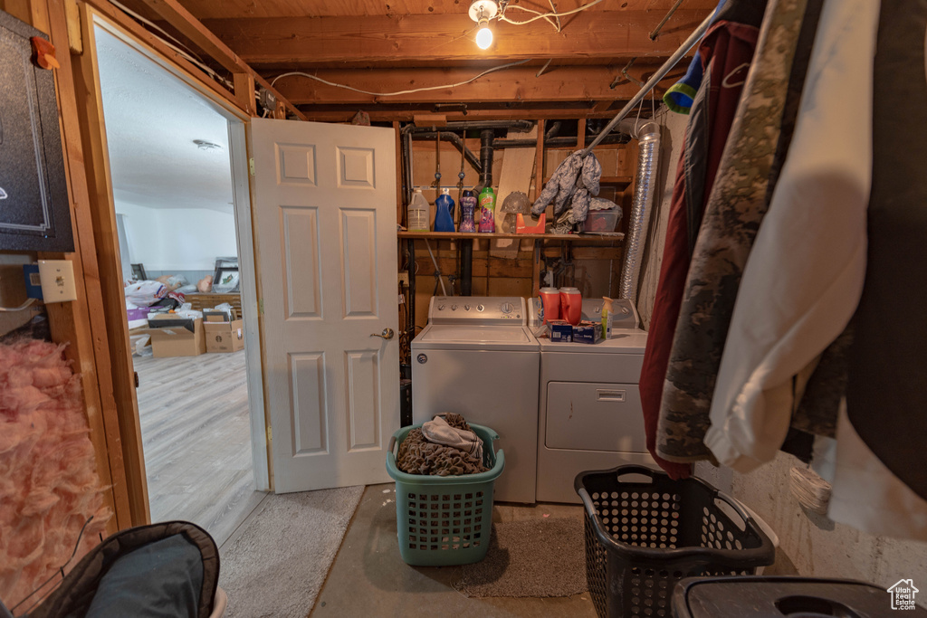 Laundry room featuring washing machine and clothes dryer