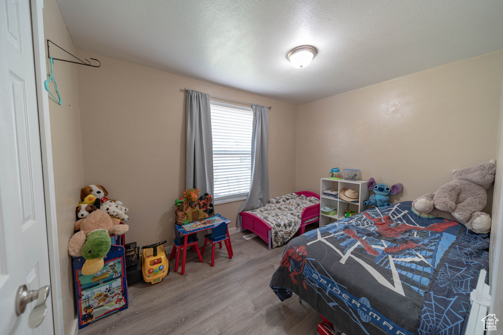 Bedroom with wood finished floors