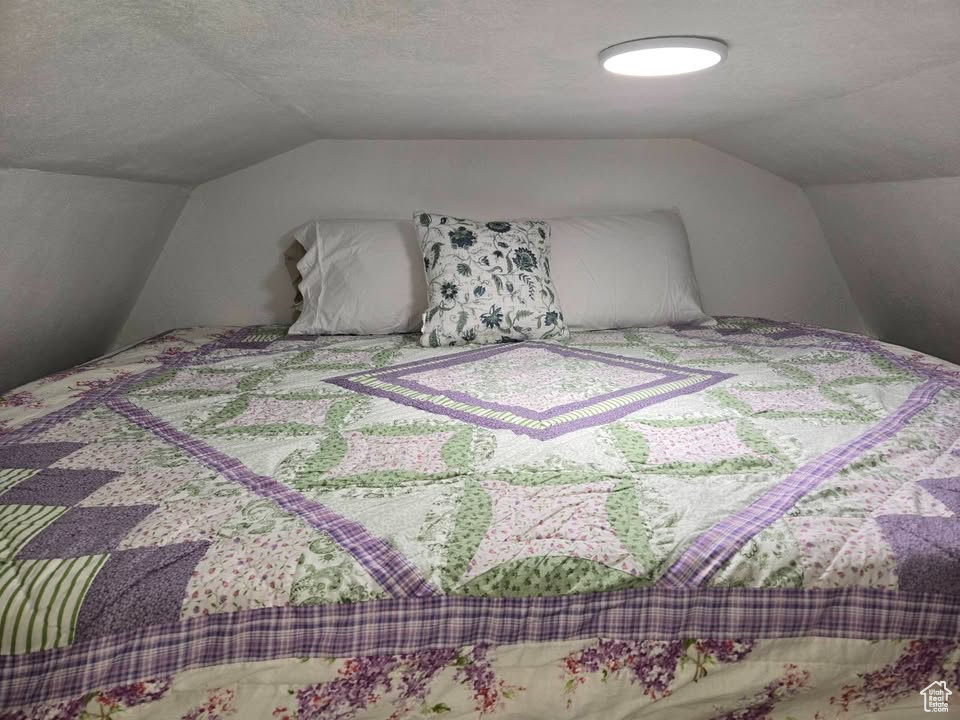 Bedroom with vaulted ceiling