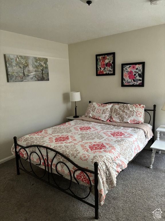 Bedroom with carpet and baseboards