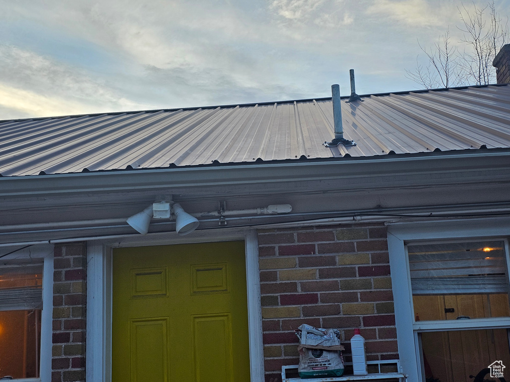 Exterior view of a metal roof and brick siding