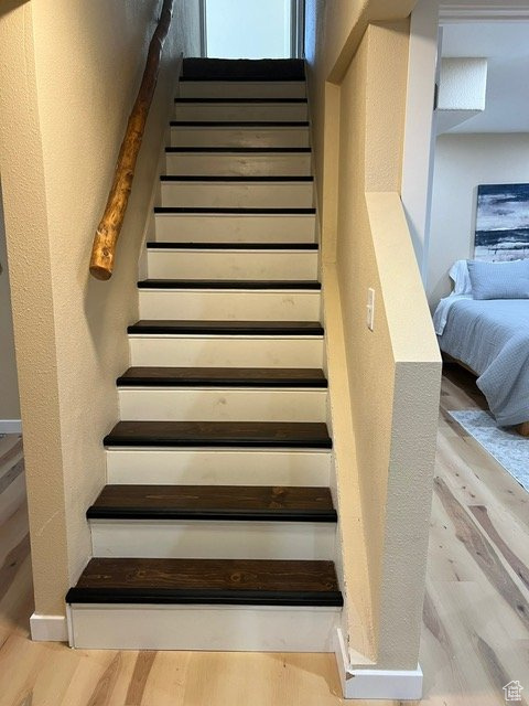 Staircase with wood finished floors