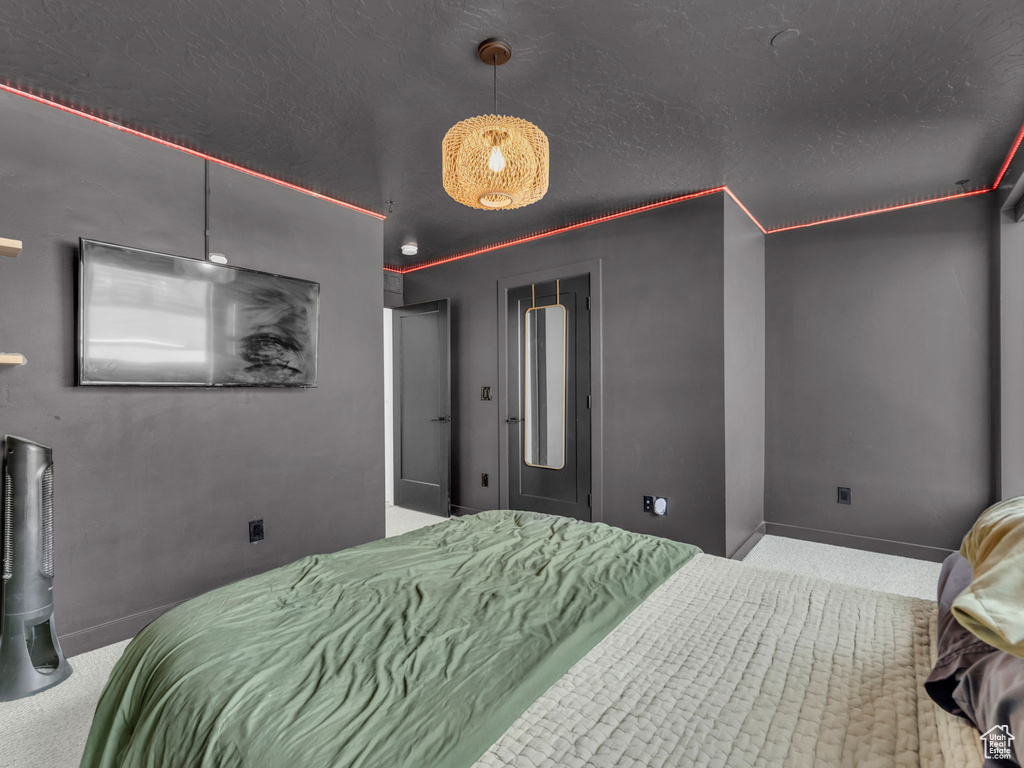 Carpeted bedroom with baseboards
