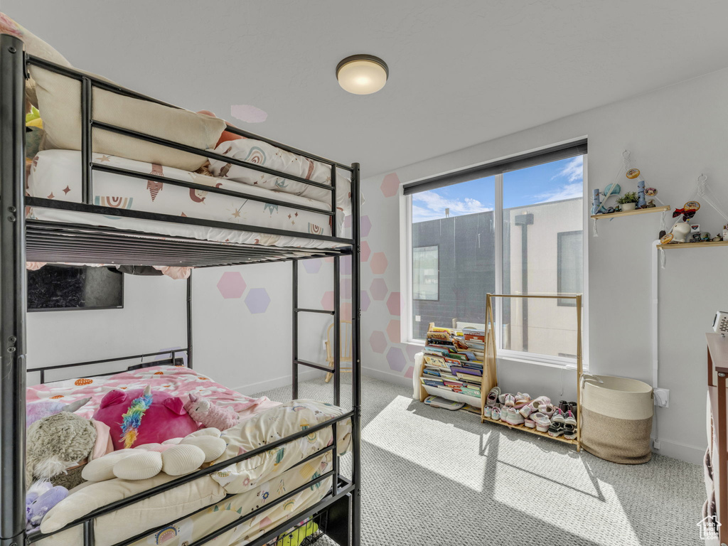 Carpeted bedroom with baseboards
