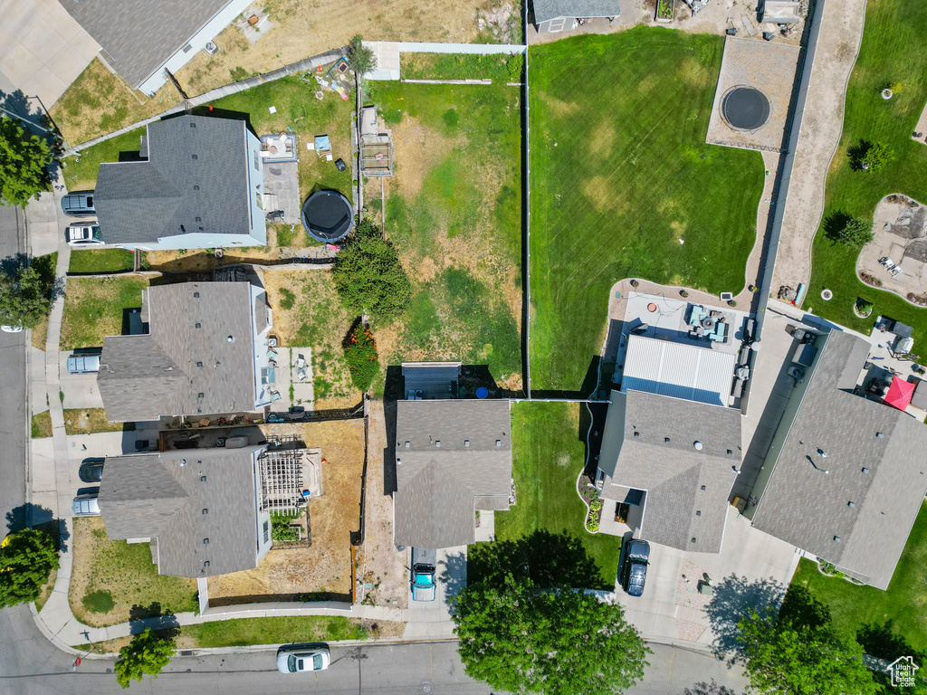 Aerial view of property and surrounding area with nearby suburban area