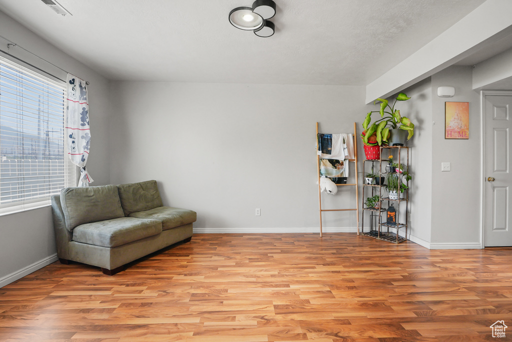 Living area with light wood-type flooring