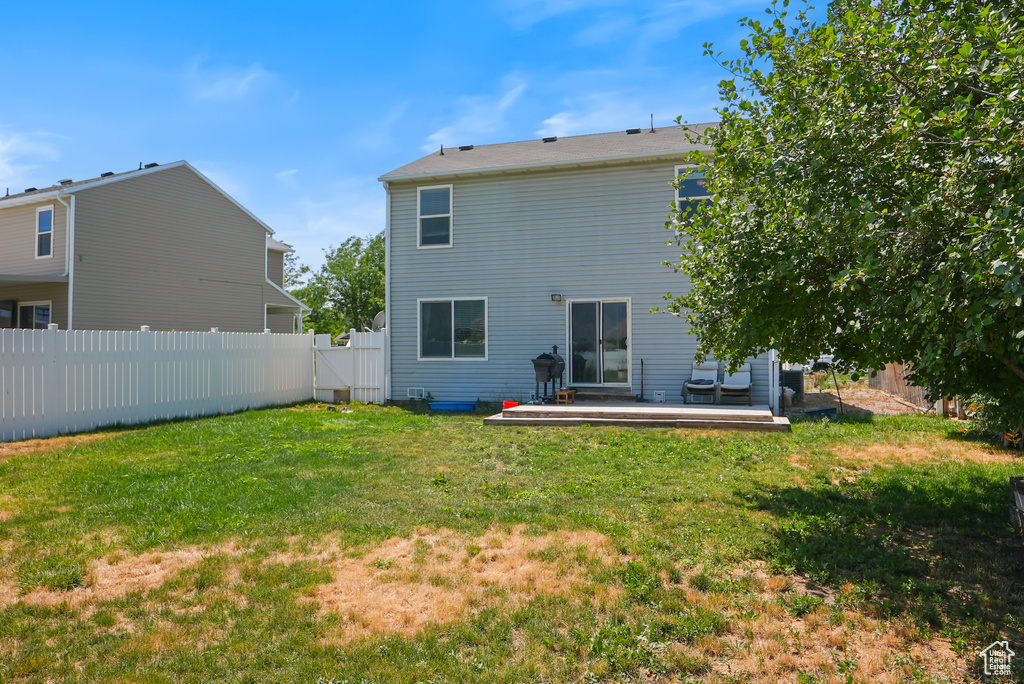 Rear view of property with a deck