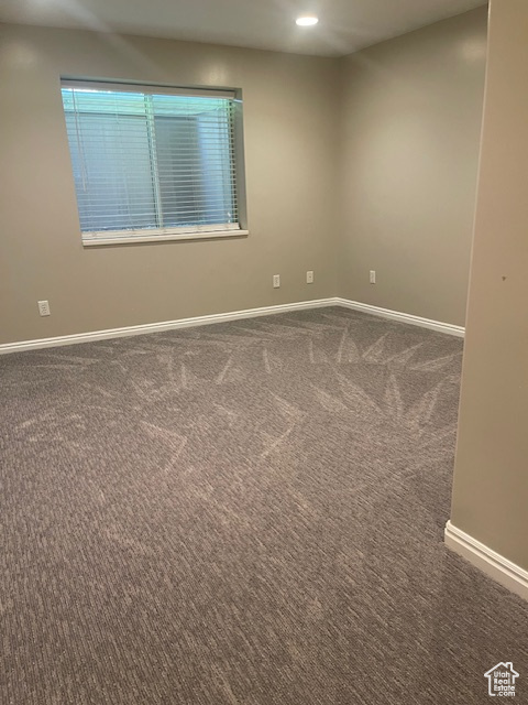 Carpeted empty room featuring recessed lighting and healthy amount of natural light