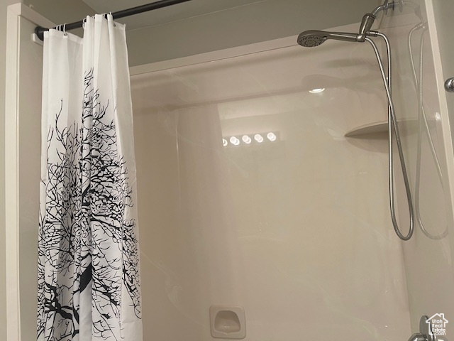 Full bathroom with a shower with curtain
