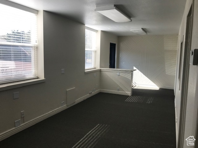 Unfurnished room featuring baseboards
