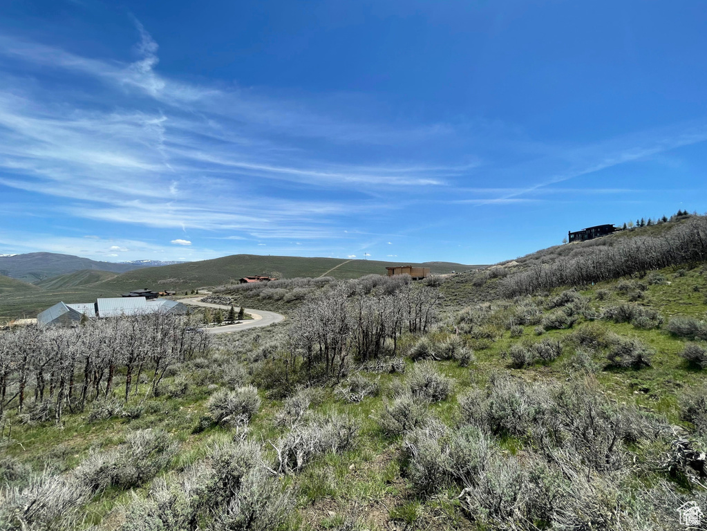 View of mountain background featuring rural landscape