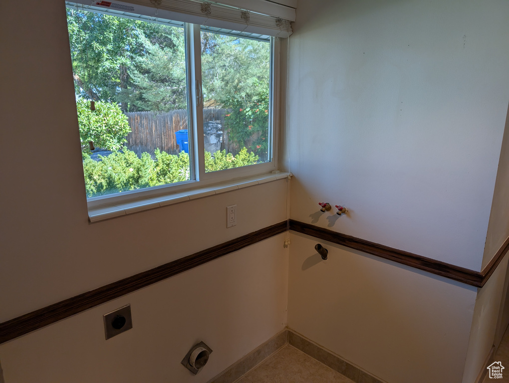 Washroom featuring electric dryer hookup and baseboards