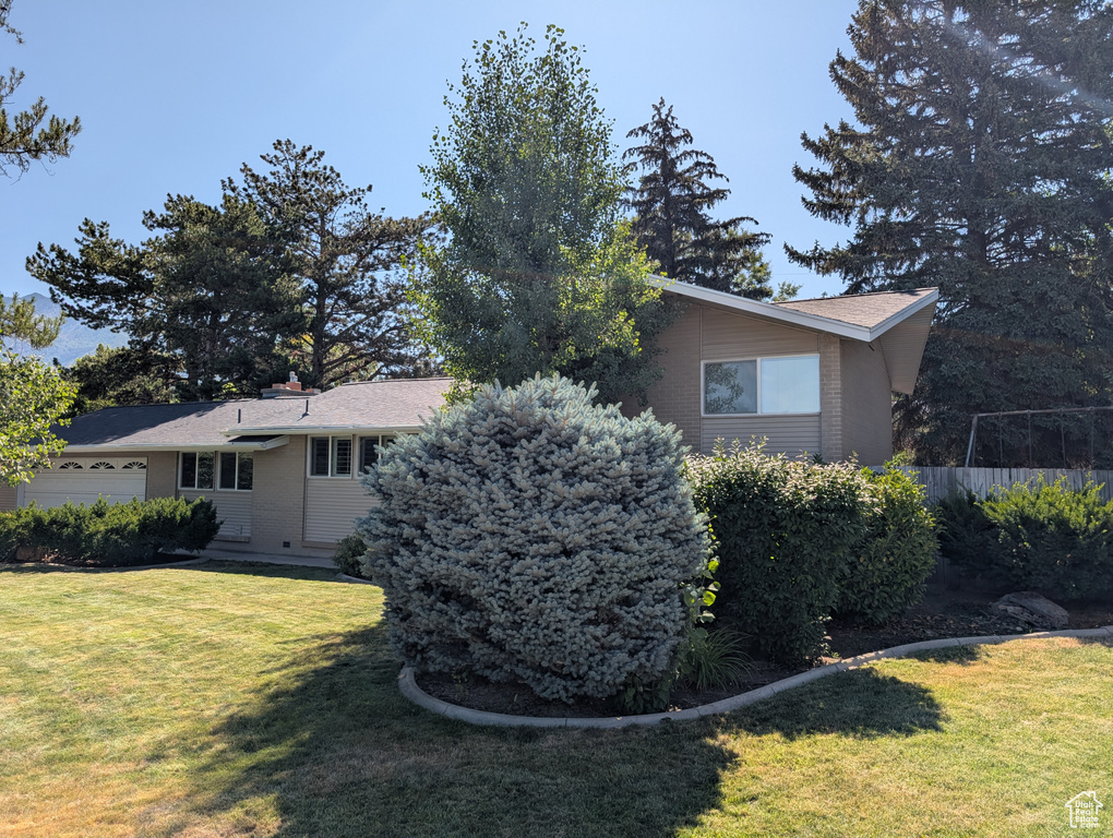 View of home\'s exterior with a garage and brick siding