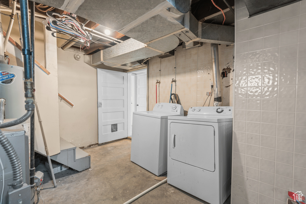 Washroom featuring washing machine and clothes dryer