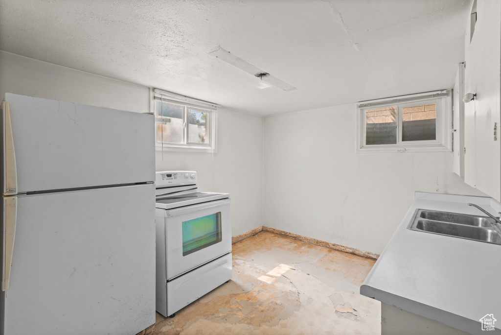 Kitchen with white appliances and light countertops