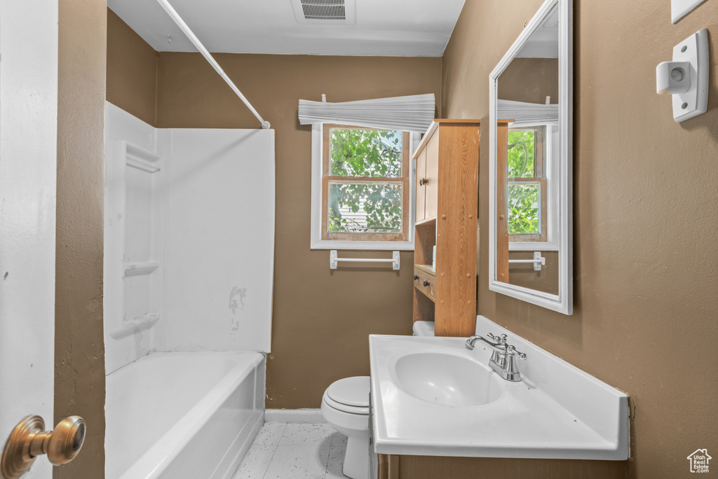 Bathroom with vanity and  shower combination