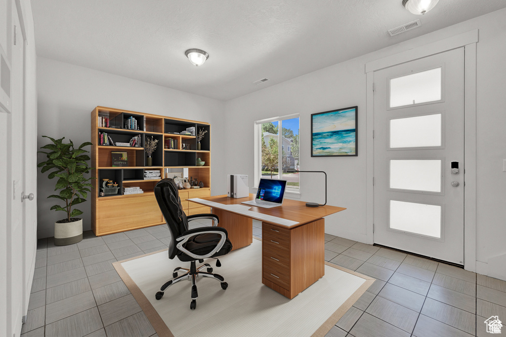 Office featuring light tile patterned floors