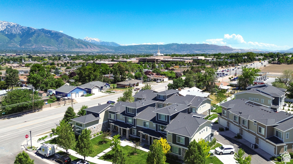 Aerial view of residential area featuring a mountainous background