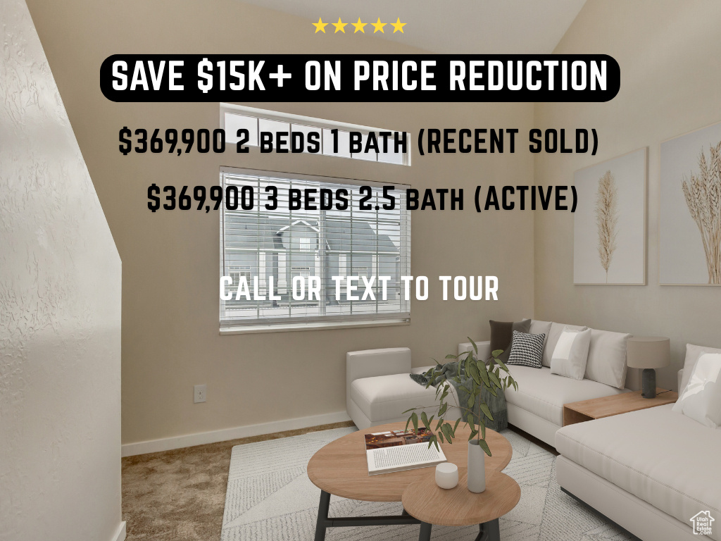 Carpeted living room featuring baseboards
