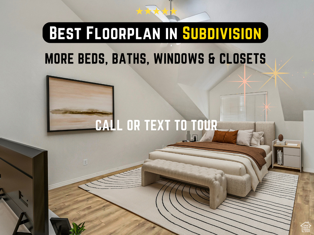 Bedroom featuring wood finished floors and lofted ceiling
