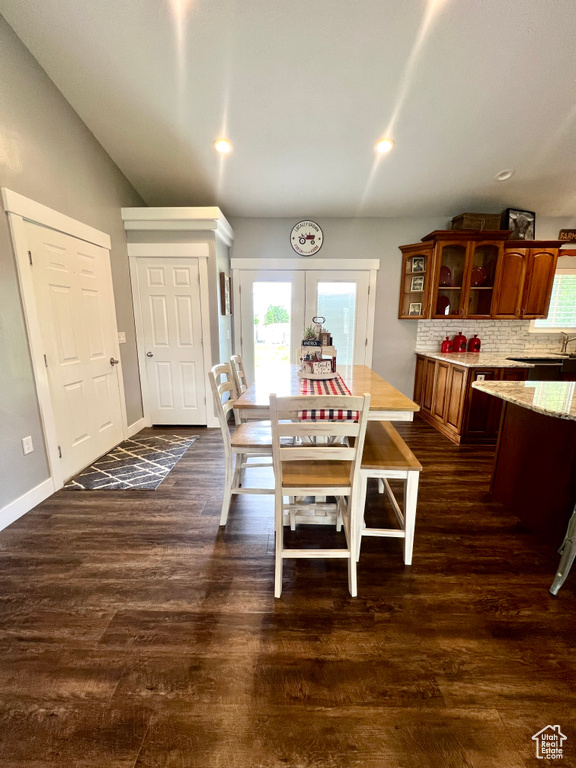 Dining area featuring plenty of natural light, dark wood-style floors, and recessed lighting