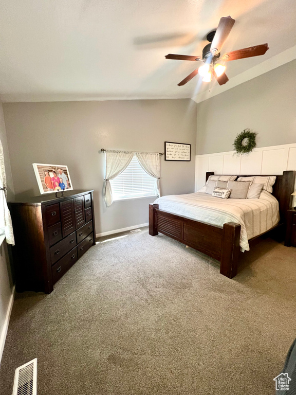 Bedroom with carpet flooring, lofted ceiling, and ceiling fan