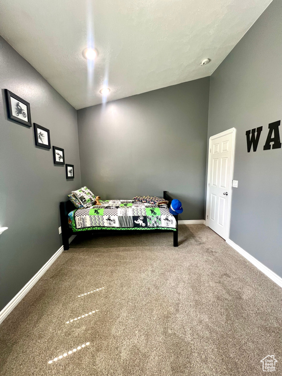 Unfurnished bedroom featuring carpet floors and baseboards