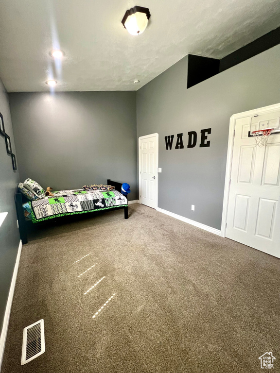Unfurnished bedroom featuring carpet floors and baseboards