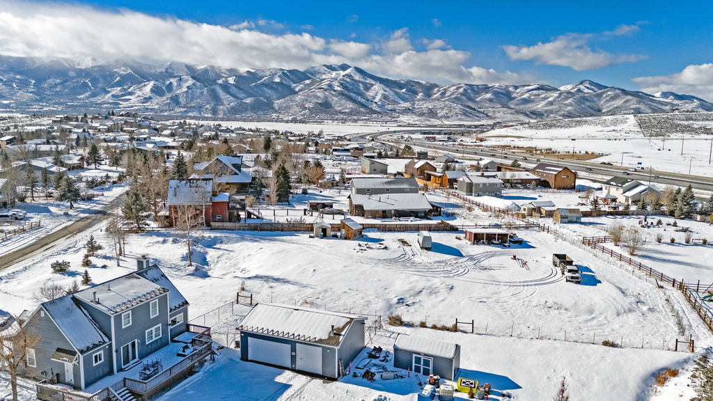 View of mountain backdrop featuring nearby suburban area