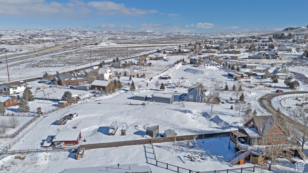 Snowy aerial view featuring a residential view