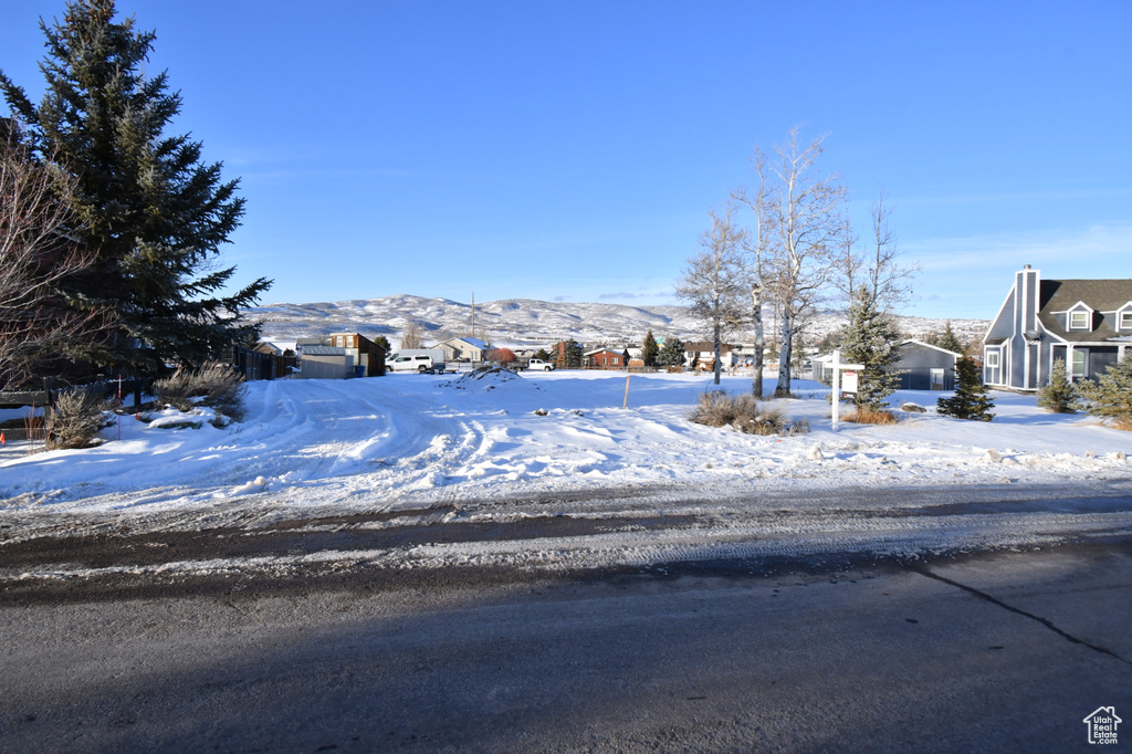 View of road featuring a mountain view and a residential view