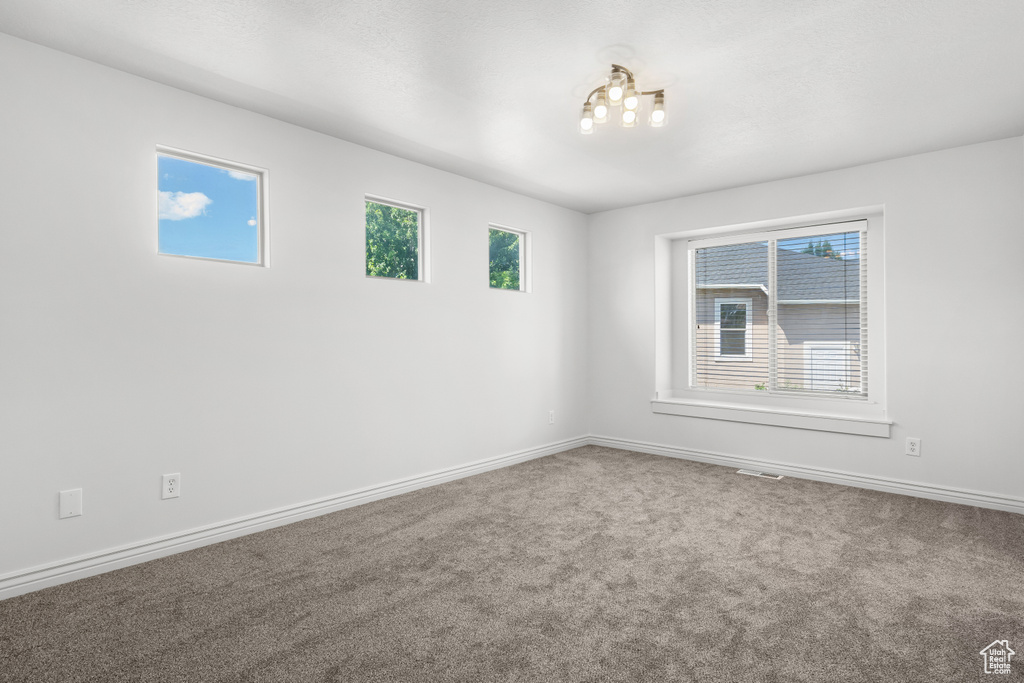 Spare room with carpet floors and baseboards