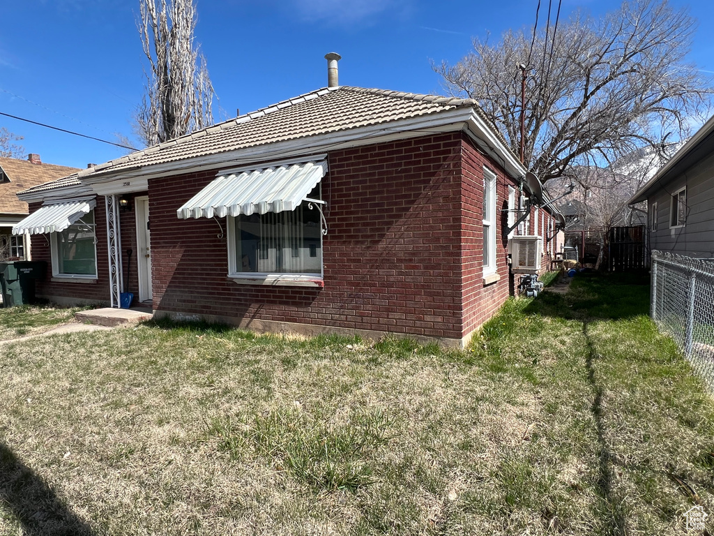 View of side of property with brick siding