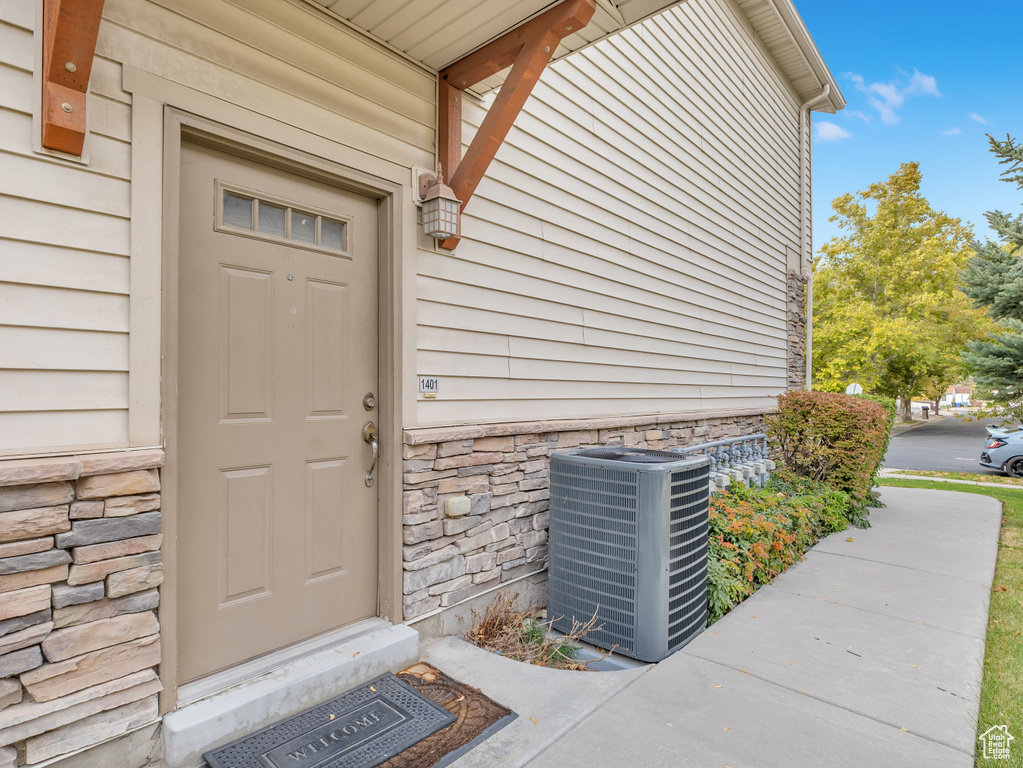 View of exterior entry featuring stone siding