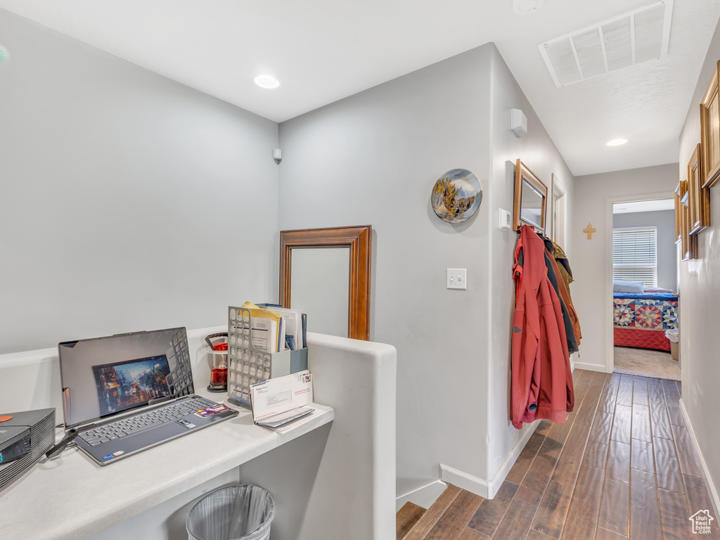 Office space featuring baseboards and dark wood finished floors