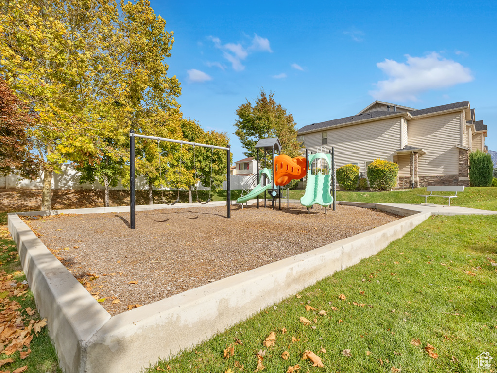 Community jungle gym with a lawn