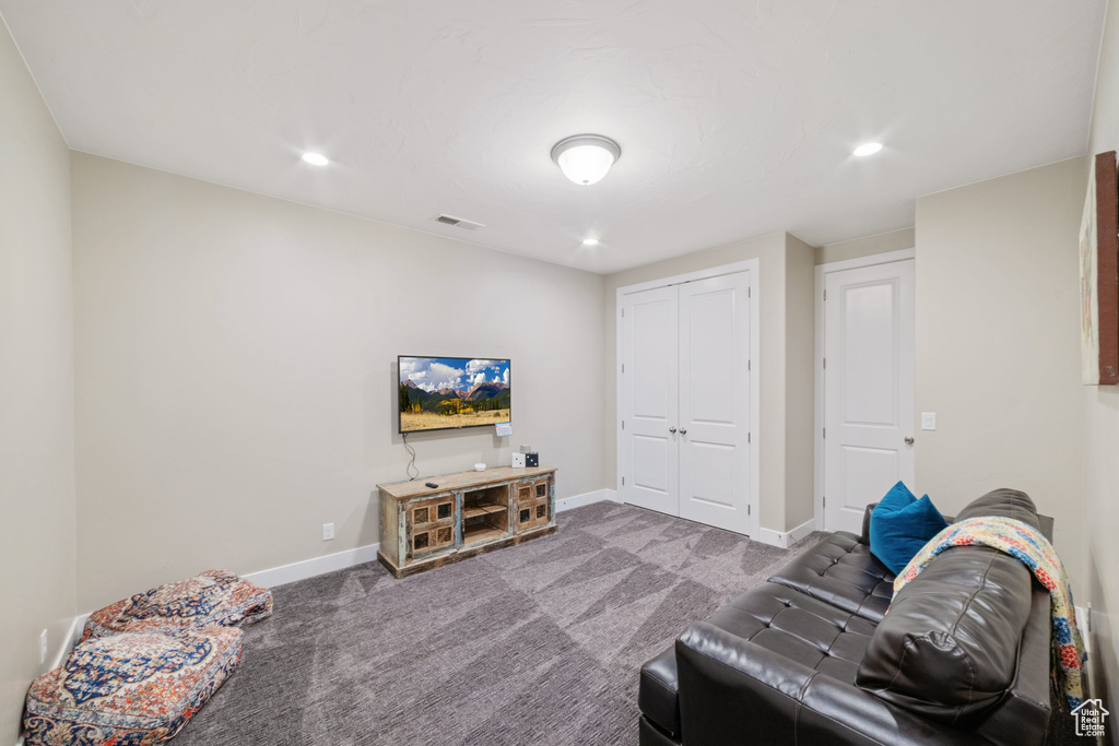 Living room featuring carpet and recessed lighting