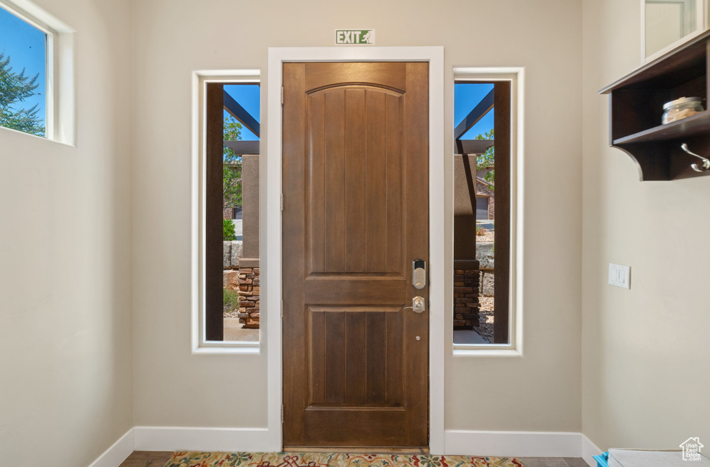 Foyer entrance featuring baseboards