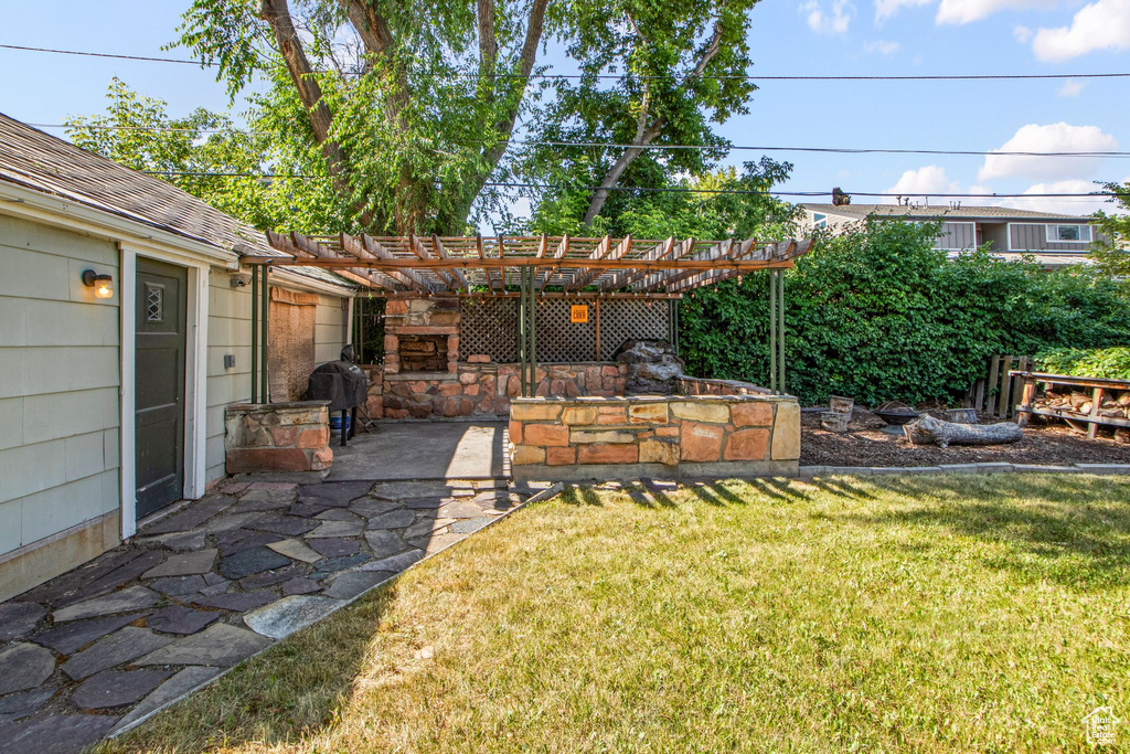 View of yard featuring a pergola and a patio area