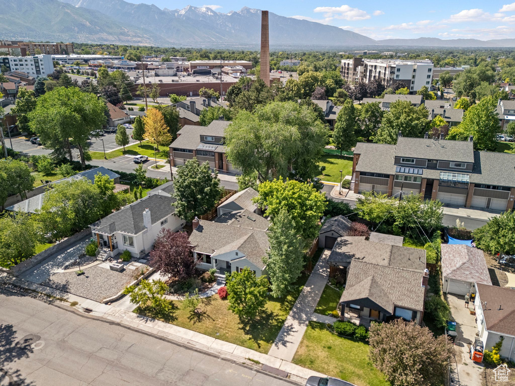 Aerial perspective of suburban area featuring a mountain backdrop