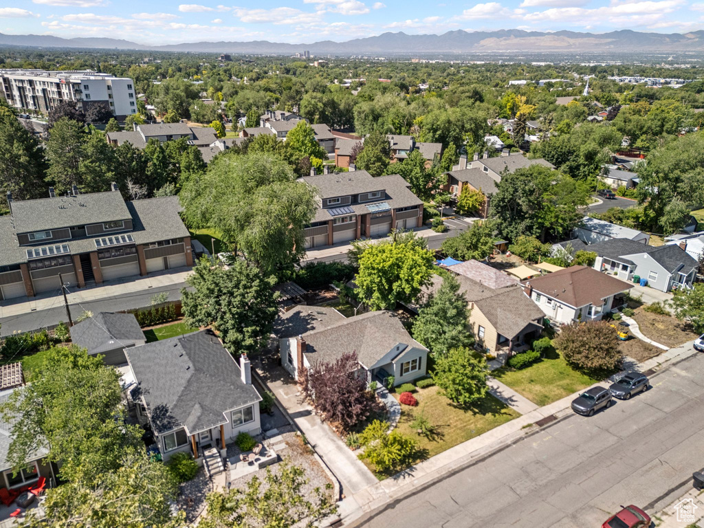 Aerial perspective of suburban area with a mountainous background