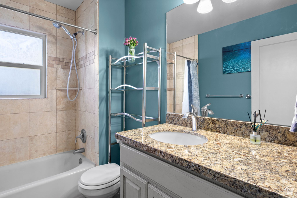 Full bathroom with vanity and shower / bath combo with shower curtain
