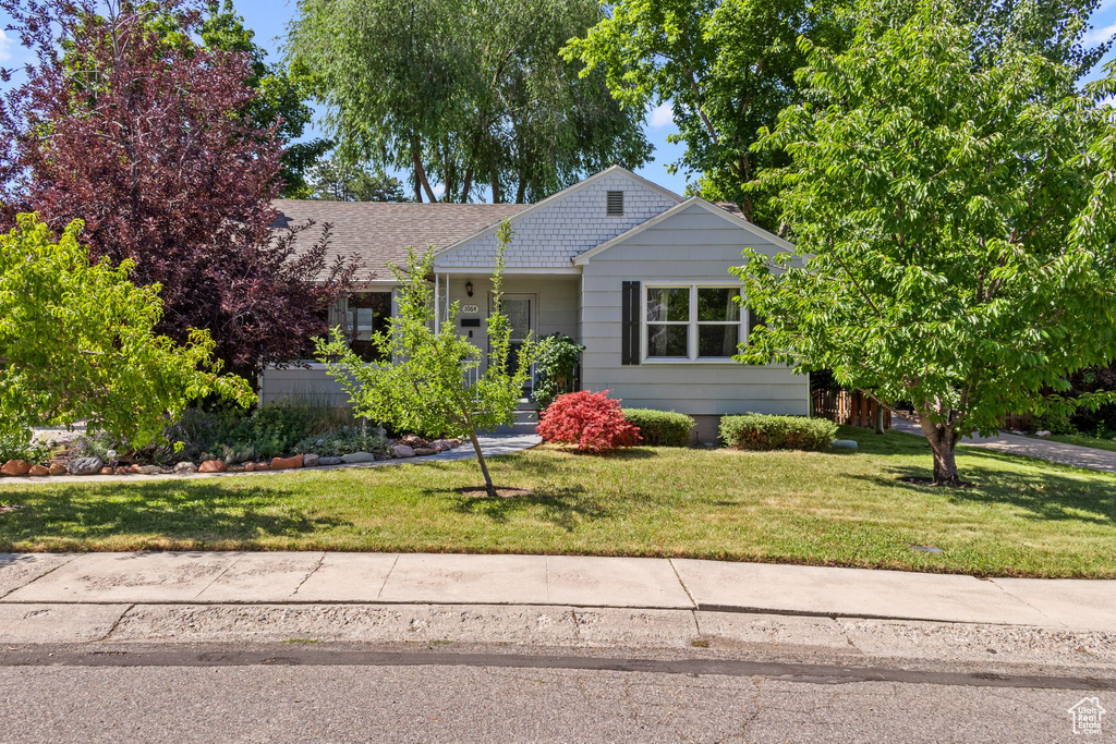 View of front of property with a front lawn