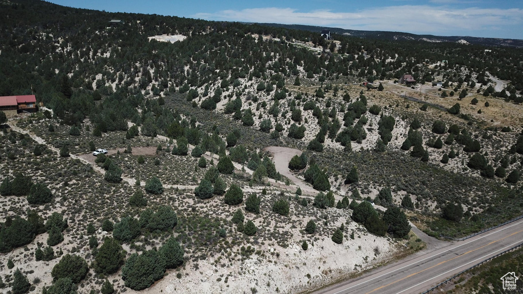Aerial view of property and surrounding area with mountains