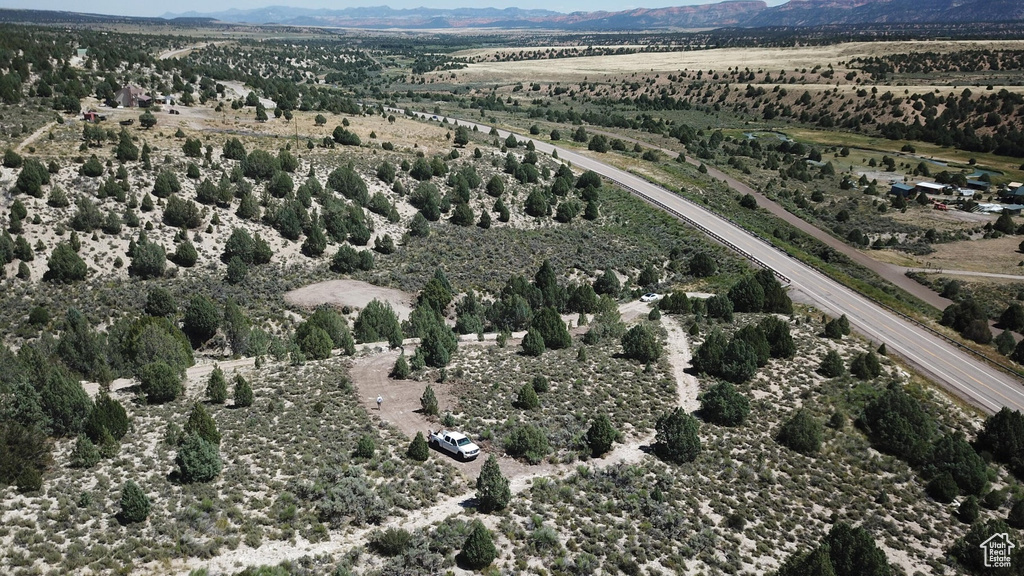 Aerial view of property's location with a mountainous background