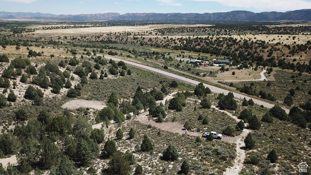 View of property location featuring a mountain backdrop and rural landscape