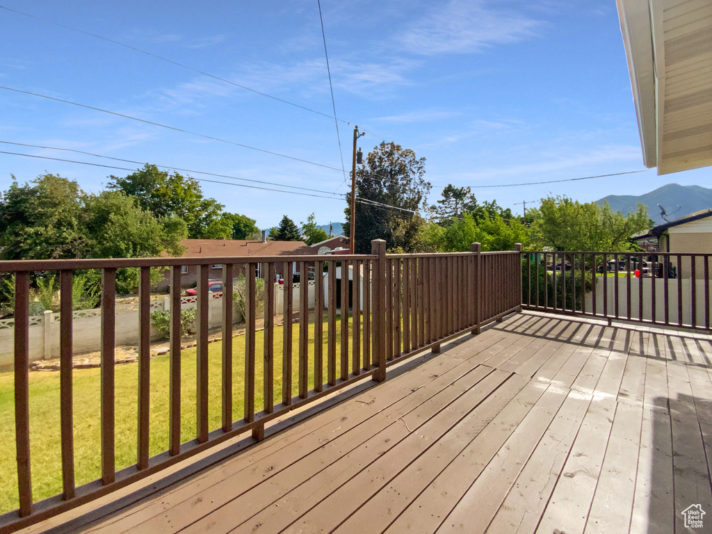 Wooden terrace with a lawn