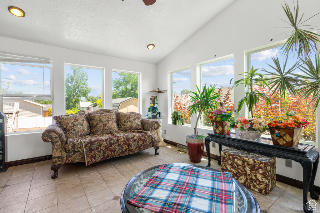 Sunroom / solarium featuring healthy amount of natural light and vaulted ceiling