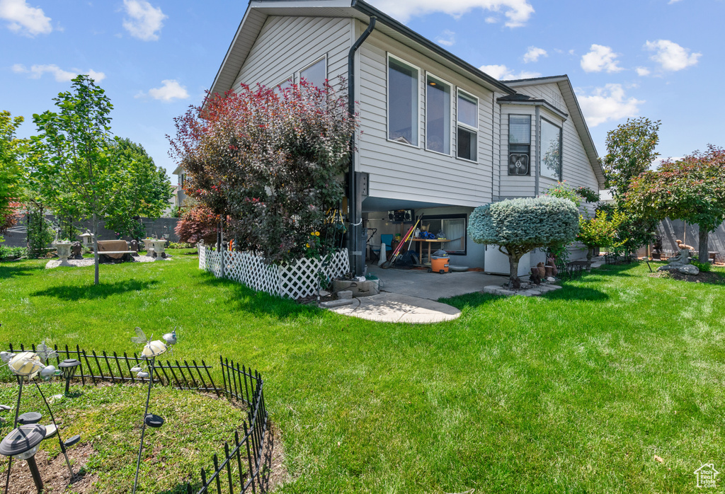 Rear view of property featuring a patio area