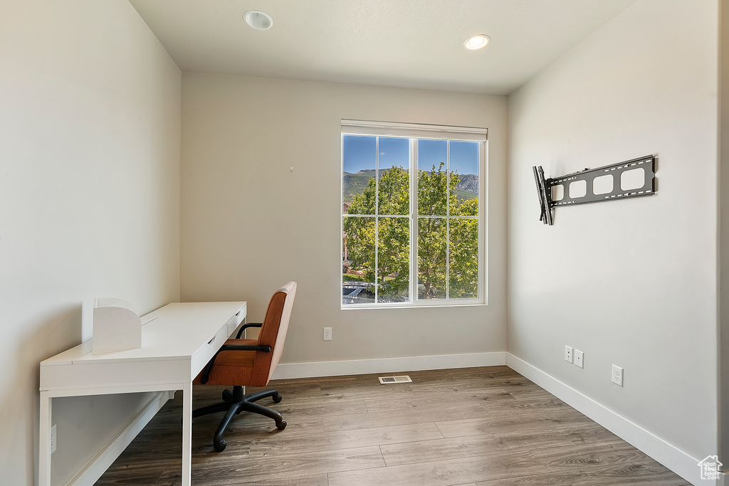 Office space featuring recessed lighting and wood finished floors